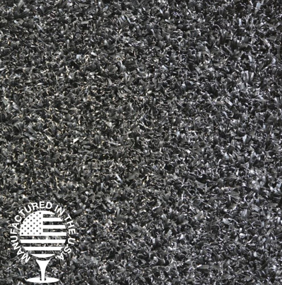 Close-up of premium black artificial turf, manufactured in the USA, featuring durable fibers ideal for playgrounds and custom landscape designs by Southwest Greens.