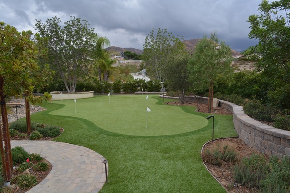 Pittsburgh Synthetic grass golf green in a landscaped backyard